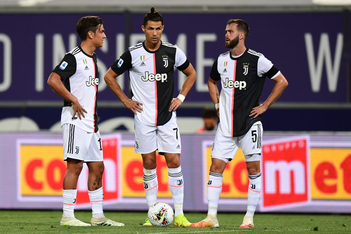 Turin, Italy - 26 June, 2020: Paulo Dybala (C) of Juventus FC celebrates  with Cristiano Ronaldo (R) and Federico Bernardeschi (L) of Juventus FC  after scoring a goal during the Serie A