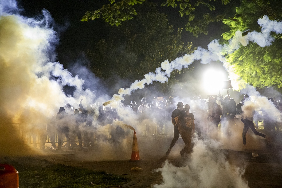 Tear gas fired to disperse protestors outside White House as clashes erupt against George Floyd killing
