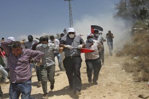 Dozens of Palestinian protesters injured in West Bank clashes