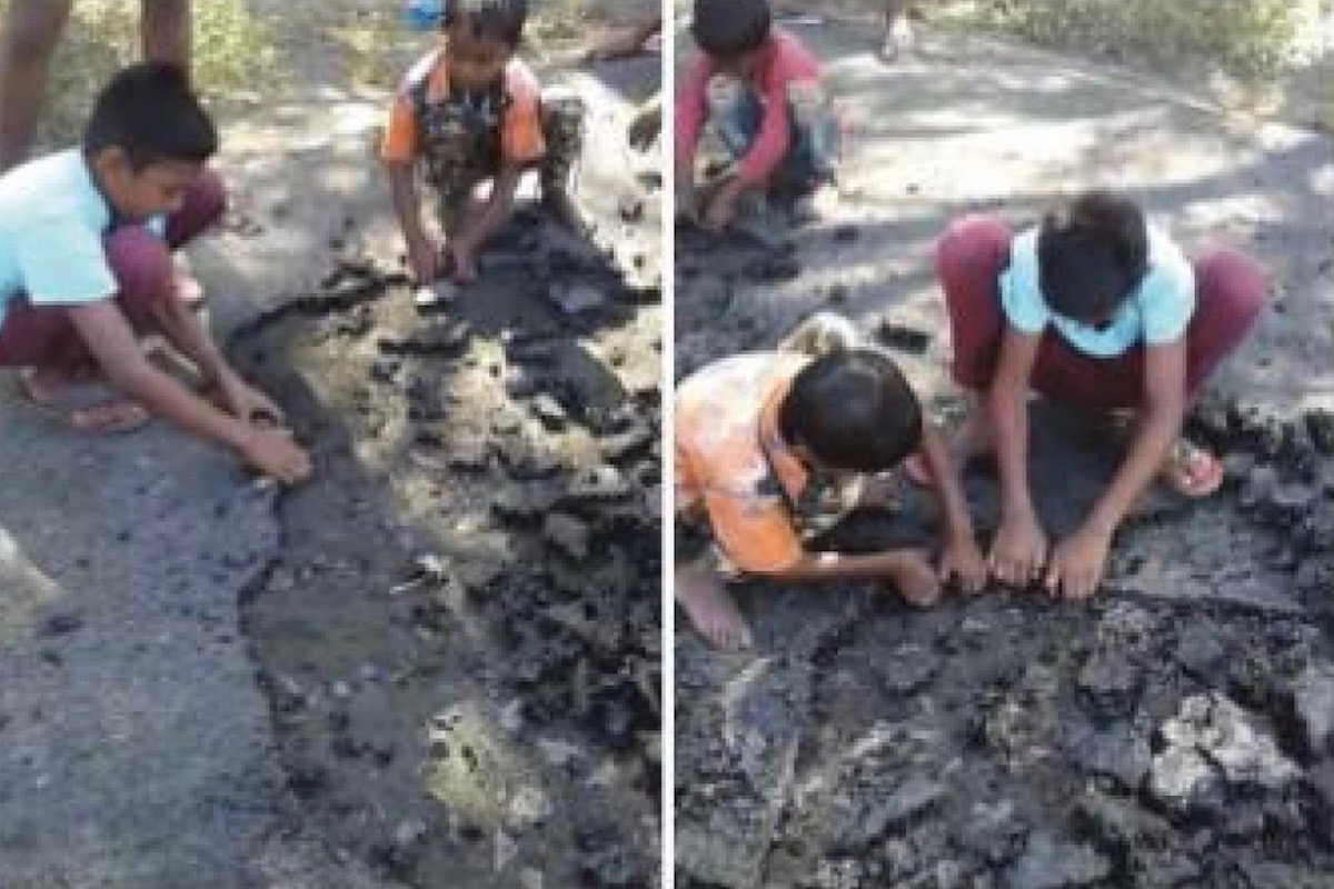 Kids scrape bitumen off after road-laying work