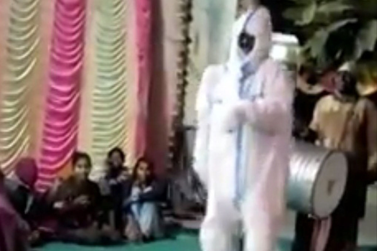 Home quarantined man dances in PPE kit at marriage ceremony