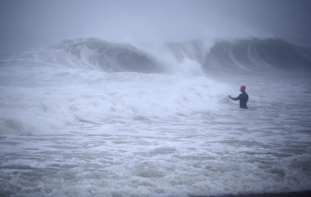 Moving inland, storm Henri drenches Northeast US