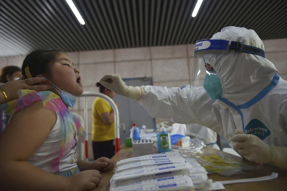 China orders mass testing in Wuhan as Covid outbreak spreads