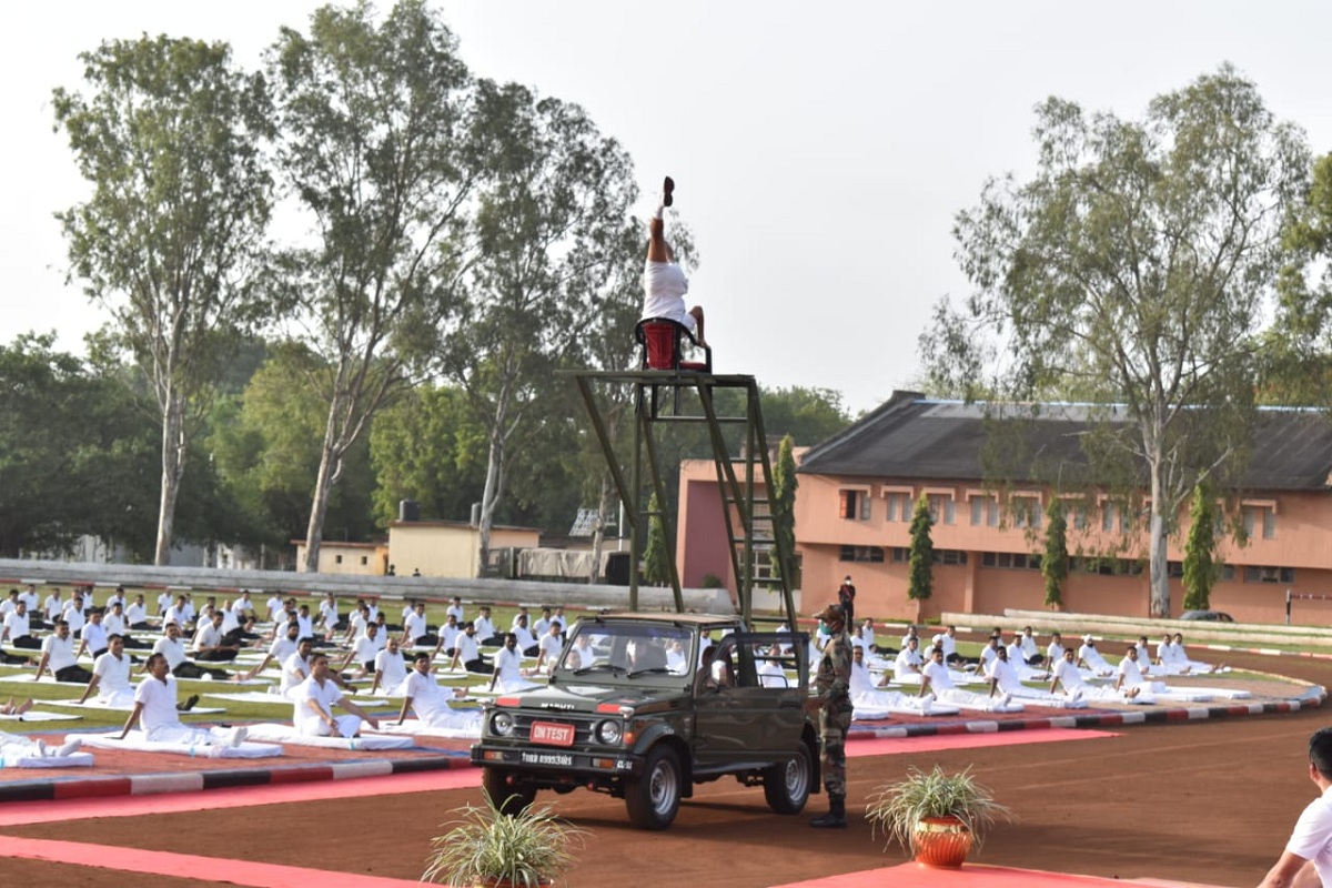 Yoga atop a 20 feet ladder on a moving vehicle
