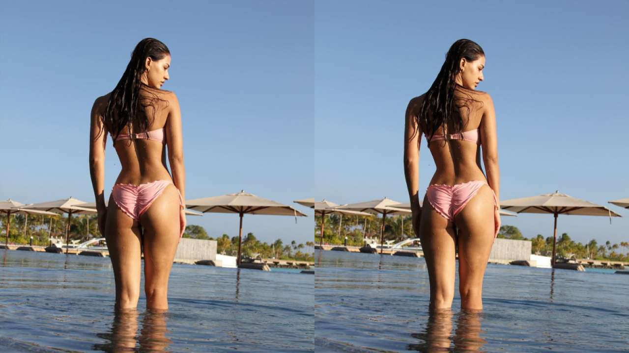 Disha Patani blazes Instagram with her new pictures in a pink bikini