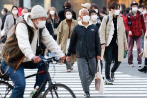 Japan extends strict border measures as coronavirus cases rise