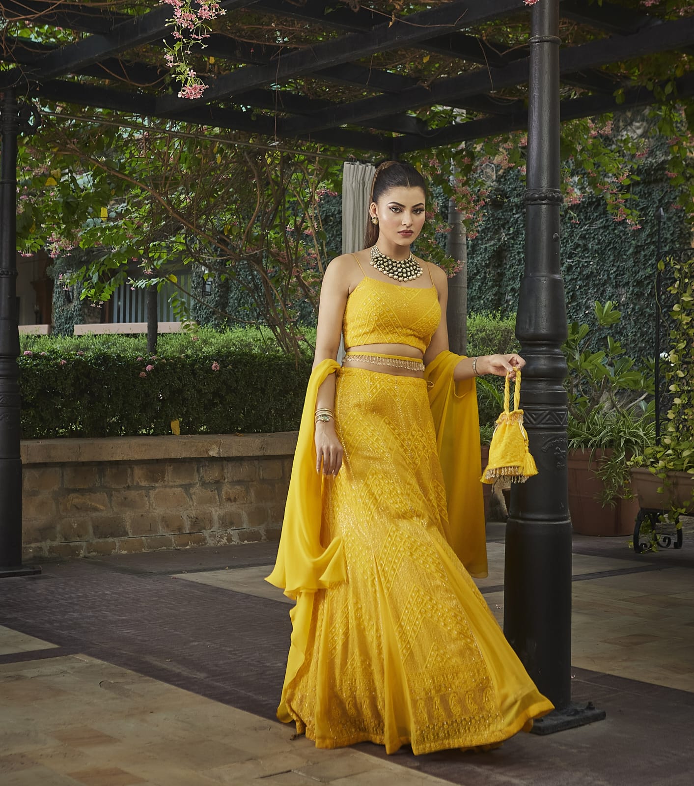 Urvashi looked stunning gorgeous in a sunshine yellow color flared Lehenga Choli Set.