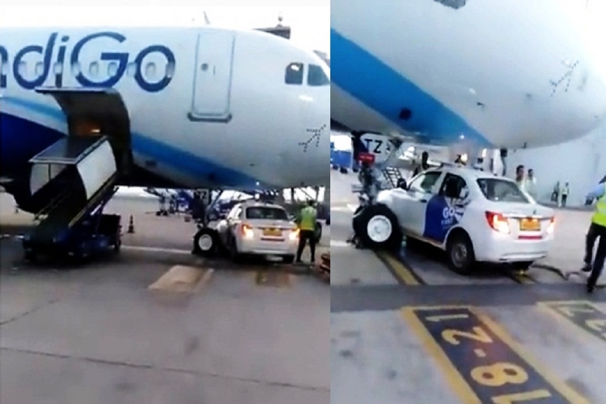 Car stops under parked IndiGo aircraft at Delhi airport