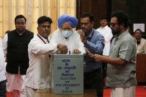 Former PM Manmohan Singh arrives on wheelchair to cast his vote