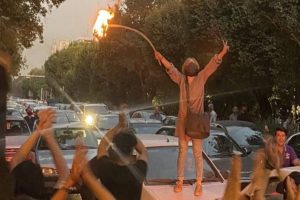 Women burn headscarves as anti-hijab protests continue in Iran