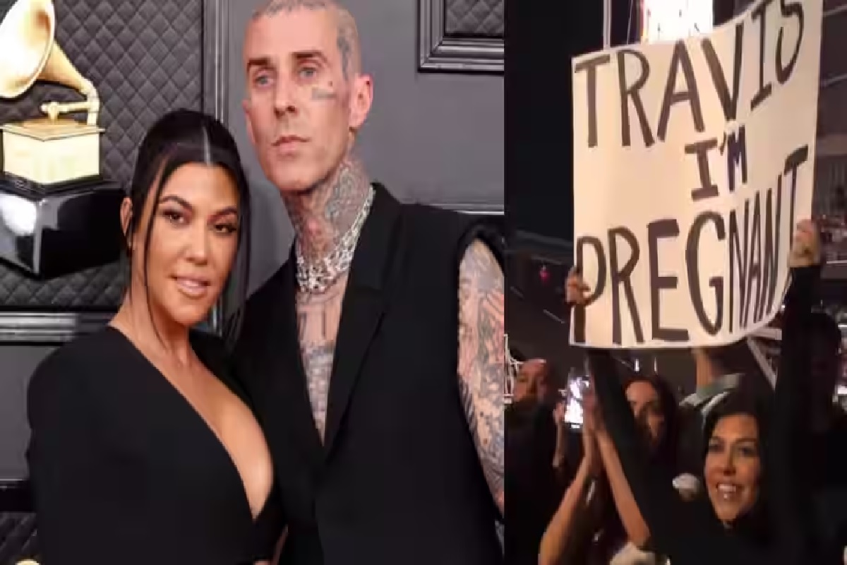 Who is Travis Barker and who showed him the “Travis I am pregnant” placard