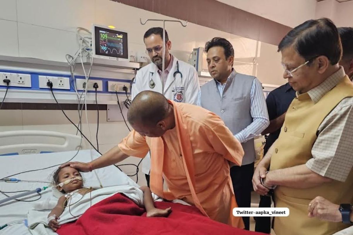 Yogi meets injured in courtroom firing including a baby girl