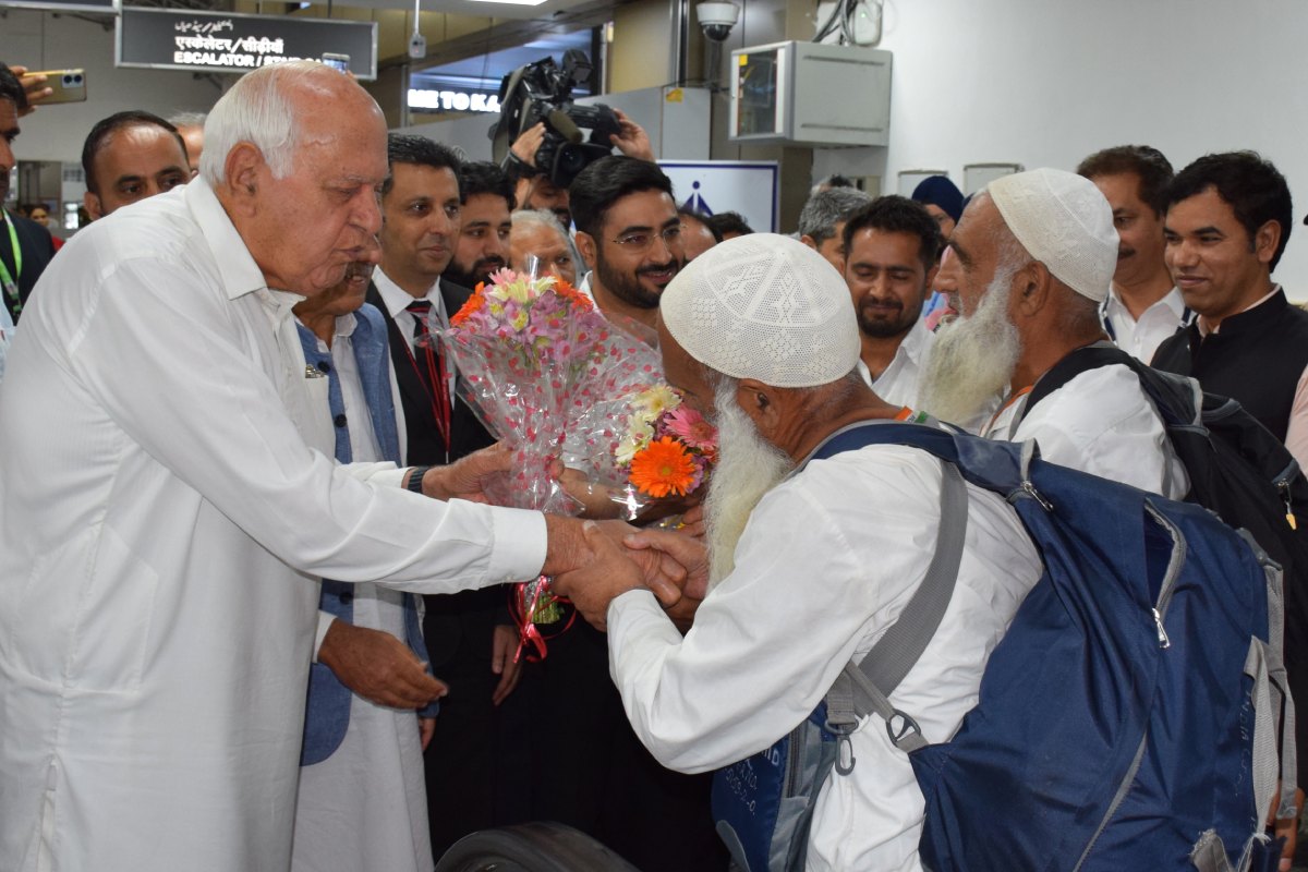 Farooq Abdullah receives first batch of hajis at Srinagar airport