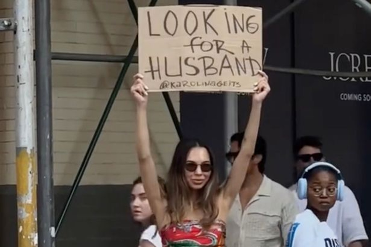 Model Karolina Geits searches for love with “Looking for a Husband” sign on NYC streets