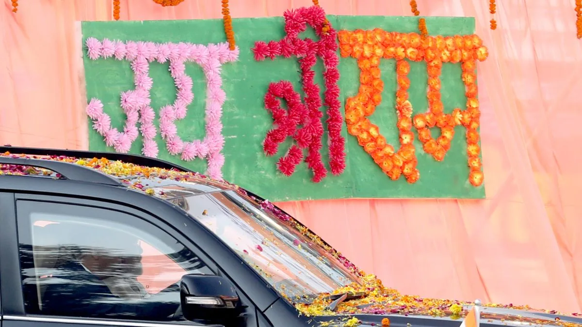 PM Modi’s convoy passes through Ayodhya as flower petals and ‘Jai Shri Ram’ decorations line the road.