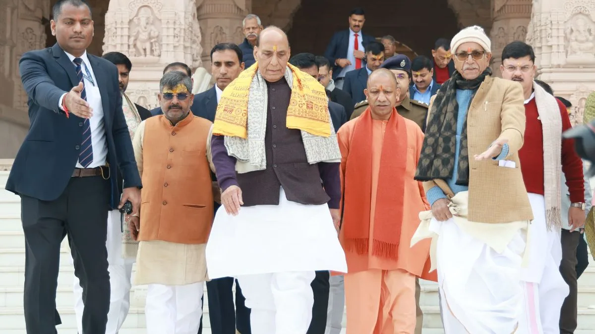 UP CM, Defence Minister offer prayers at Hanumangarhi, Ramlala Temple; hoist religious flag at Annapurna Temple