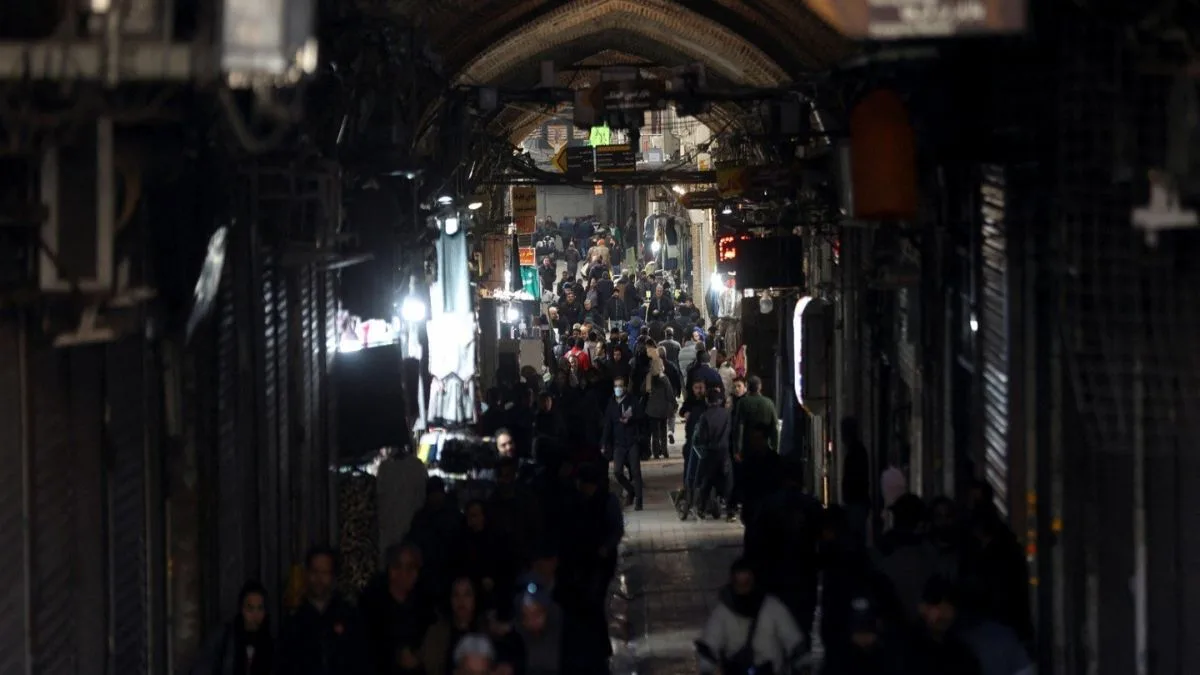 People walk through a crowded market area in Iran amid nationwide protests and security clampdown, file photo