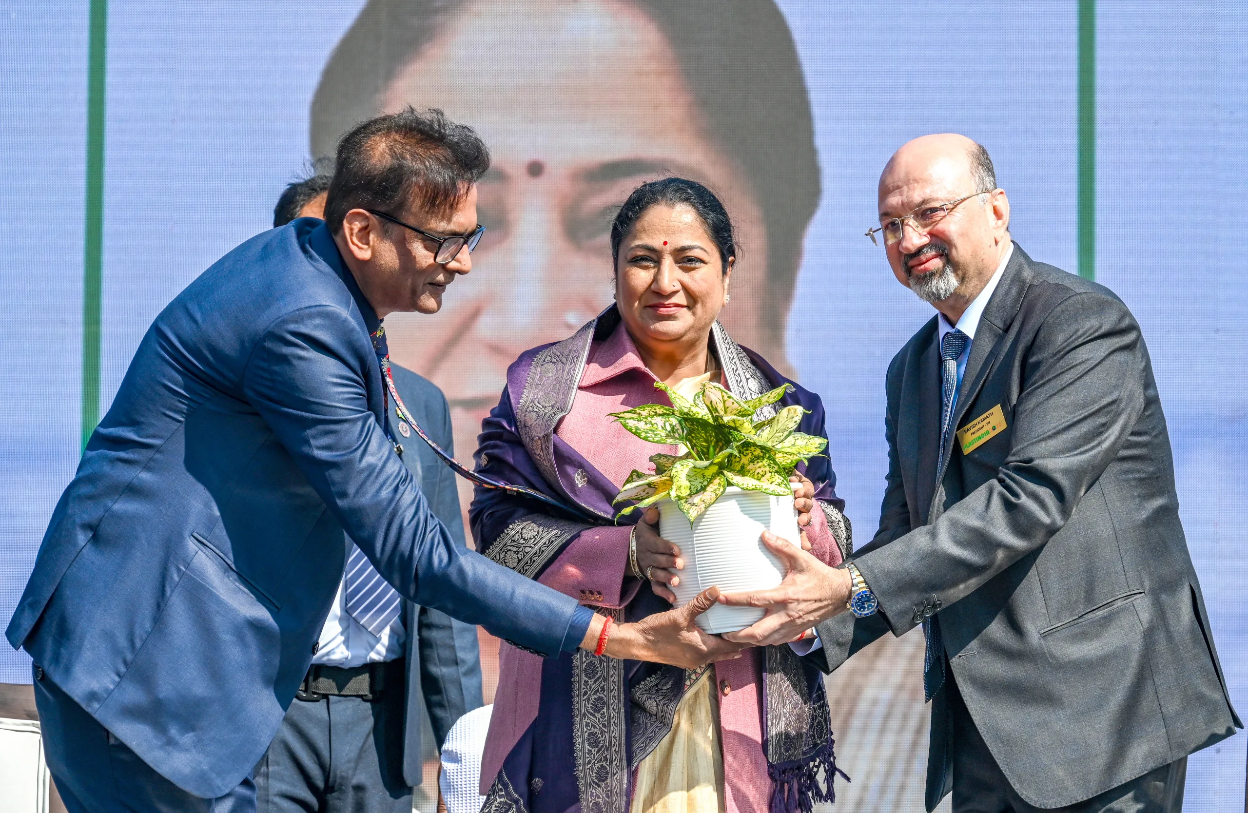 Delhi Chief Minister Rekha Gupta is felicitated with a plant by Plastindia Foundation President Ravish Kamat and Chairman Alok Tibraval. img
