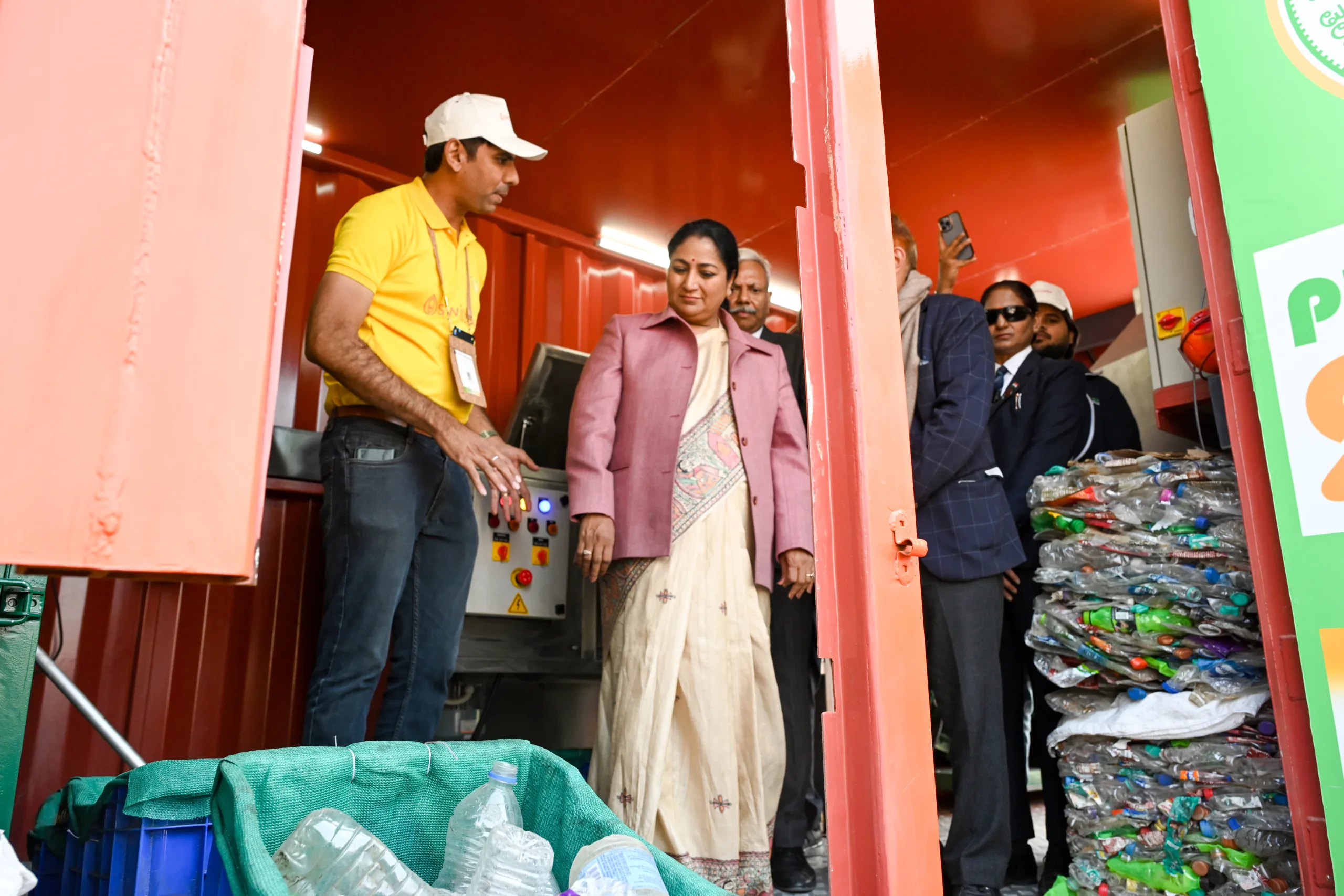 Delhi CM observes product demonstrations at a stall during her visit. img