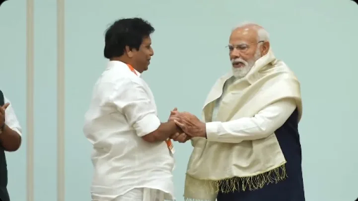 Narendra Modi interacts with the representative, commending their efforts and assuring continued support for strengthening the party’s presence in the state. img