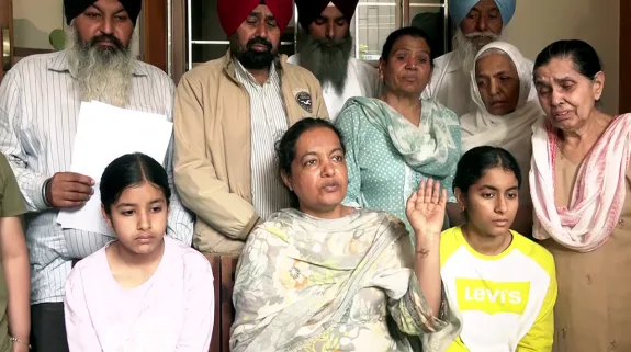 Wife of deceased Gagandeep Singh Randhawa, Upinder Kaur speaks to media in the relation to Punjab Warehousing Corporation (PWC) official suicide case of her husband, in Amritsar on Sunday. (ANI Video Grab) National::ANI Video Grab