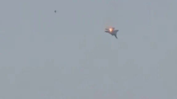 Fighter jet seen mid-air with visible flames during alleged incident over Kuwait