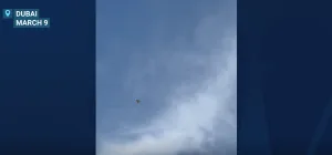 A beachgoer in Dubai captured another video showing a buzzing drone flying inland as a warplane thundered overhead, launching an interception missile moments later.