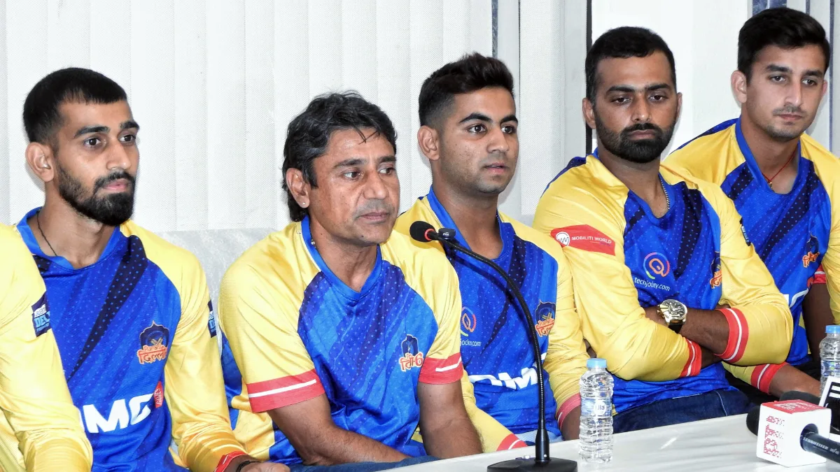 Purani Dilli 6 coach Vijay Dahiya with team players during a press conference ahead of the Delhi Premier League (DPL) T20 semi final match, in New Delhi on Friday, September 06, 2024.(Photo: IANS/Anupam Gautam)