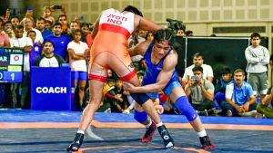 Wrestler Vinesh Phogat (in blue) competes against Jyoti in the women's 53kg category wrestling bout during the Asian Games selection trials