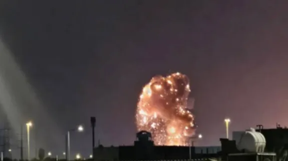 A large explosion lights up the night sky above Qatar's Ras Laffan industrial complex as flames and debris rise from the facility.
